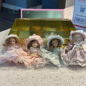 Set of Four Porcelain Dolls in Pastel Dresses